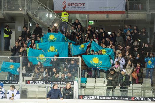 VIENNA - FEB 3: International hockey game between Austria and Kazakhstan. Fans of Team Kazakhstan celebrating the first goal on February 3, 2013 at Albert Schultz Halle in Vienna, Austria.