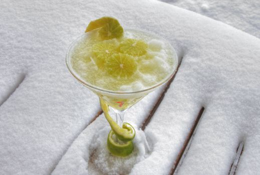 Decorated frozen marguerita drink on a bed of snow