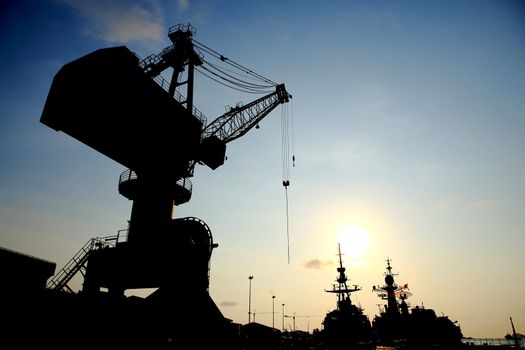 Cranes in dockside at sunset