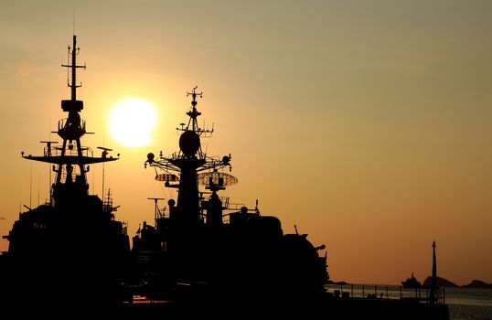 battleship with sunset behind