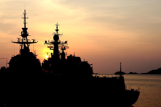 battleship with sunset behind