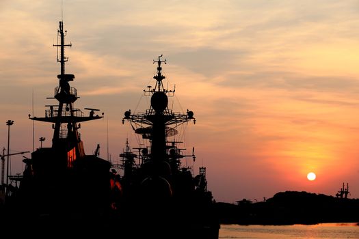battleship with sunset behind