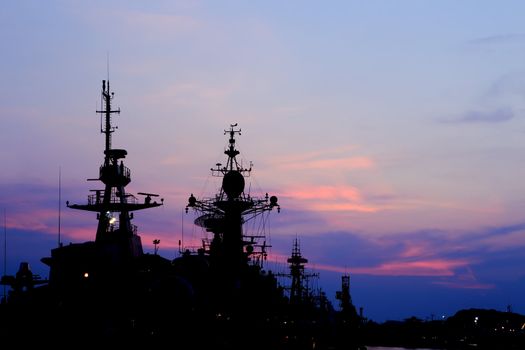 battleship with sunset behind