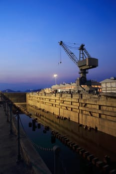 Crane near a covered dry dock at the shipyard