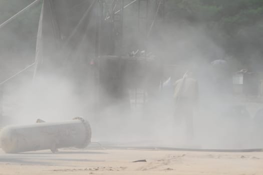 Sandblasting of metal structures at construction site