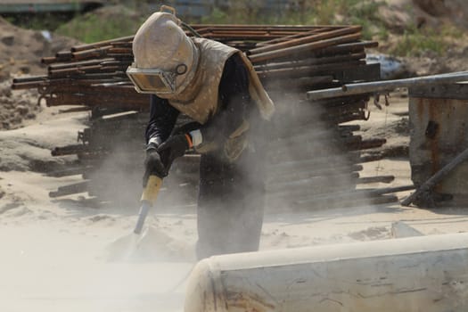 Sandblasting of metal structures at construction site