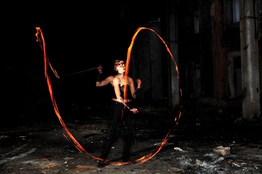 Woman holds in his hand the fire