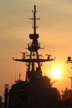 battleship with sunset behind