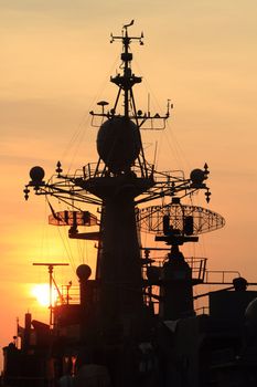 battleship with sunset behind