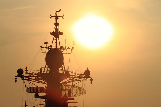battleship with sunset behind