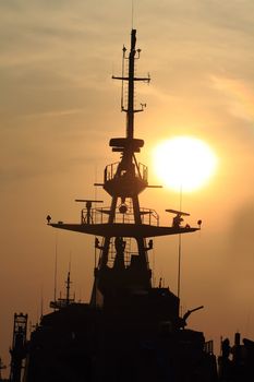 battleship with sunset behind