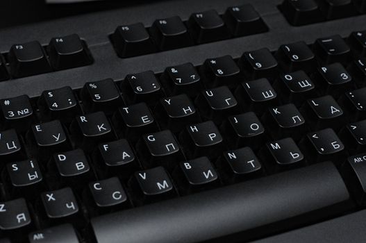 PC keyboard of black color close up view