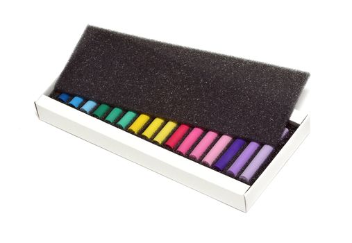 Color chalk in box isolated