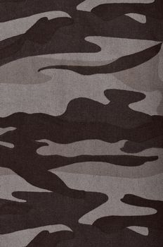 Close up camouflage fabric in a vertical orientation