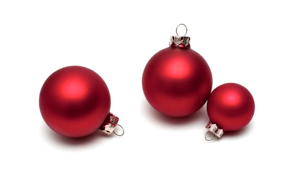 Red christmas balls on white background.