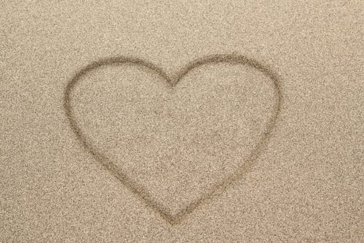 Heart shape drawn in sand for natural, symbol,tourism,holiday or conceptual designs 