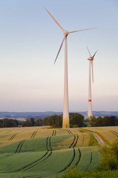 Windmills at dusk, an alternative energy source