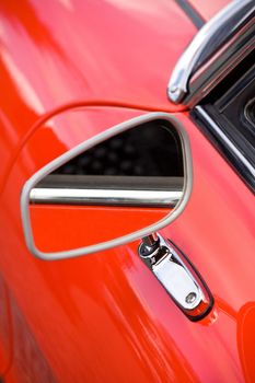 Closeup on vintage car rearview mirror, auto part