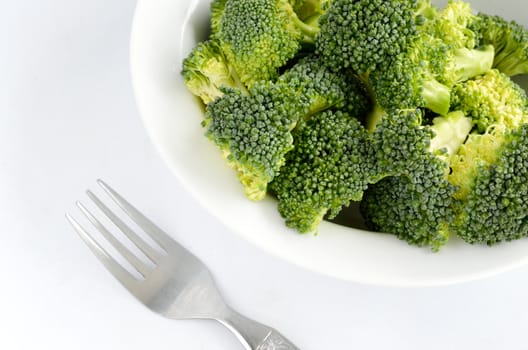 Broccoli vegetable in dish  isolated on white