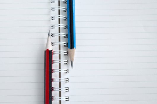 Blank notebook and pencil