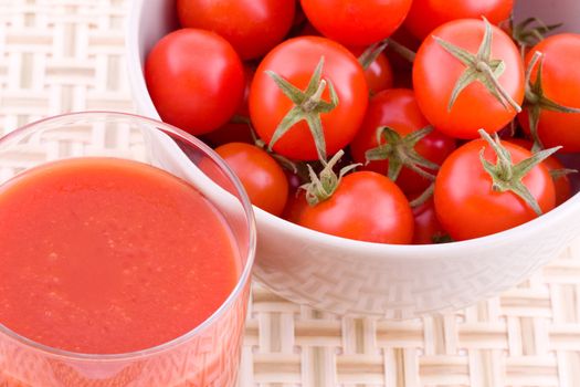 Fresh juice of small cocktail tomatoes, vegetables in a bowl