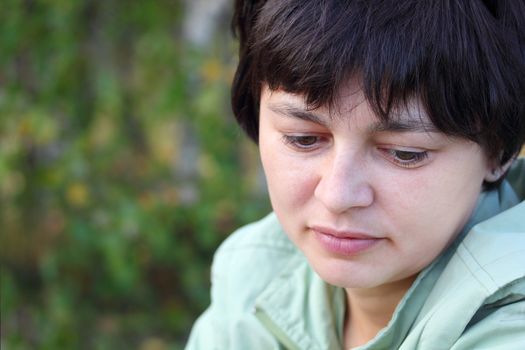 portrait of a beautiful pensive woman close up
