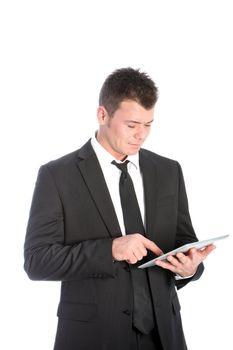 Businessman standing using a touchscreen tablet accessing information scrolling with his finger isolated on white