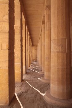 Ancient stone square and round columns in Egyptian temple