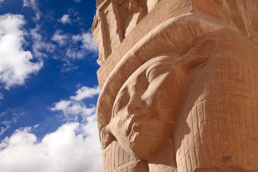 The ancient stone Hathor's head in Egyptian temple