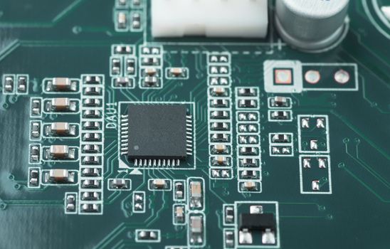 Macro view of printed circuit board with microchip