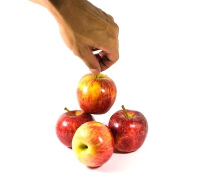 Red apples in white bowl, on white