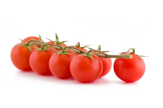 Bunch of fresh small cocktail tomatoes isolated on white