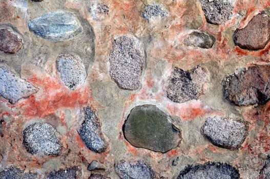 Texture of wall with colored rocks for background.