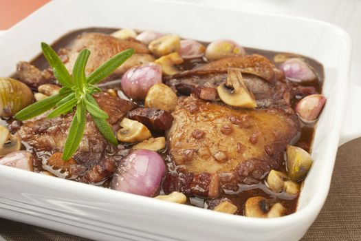 French classic, coq au vin or chicken in red wine with mushrooms, onion and bacon.  Perfect for Sunday lunch with mashed potato.