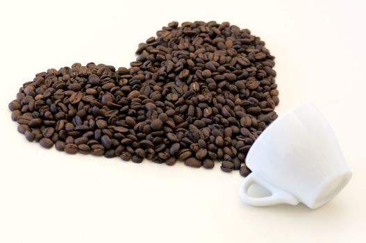 Coffee beans pouring out shaped like love symbol