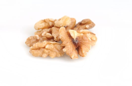Raw walnuts on a white background