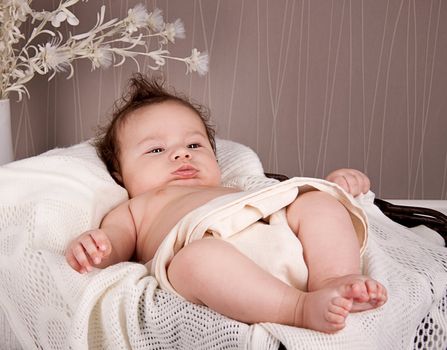 sweet little baby infant toddler on white  blanket in basket at home