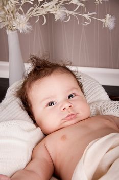 sweet little baby infant toddler on white  blanket in basket at home
