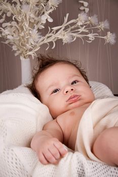 sweet little baby infant toddler on white  blanket in basket at home