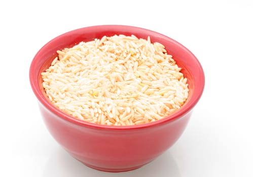Brown rice in a red bowl with nobody