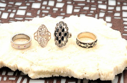 Rings or jewelry accessories in silver and white gold