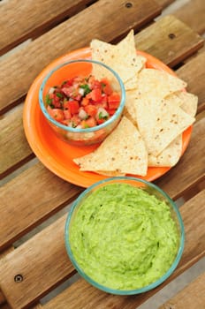 Guacamole dip with chips and salsa