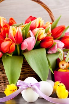 pink present with ribbon and colorful tulips festive easter decoration