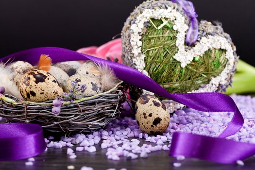 pink tulips and brown eggs with purple ribbon colorful easter decoration