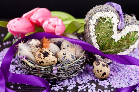 pink tulips and brown eggs with purple ribbon colorful easter decoration