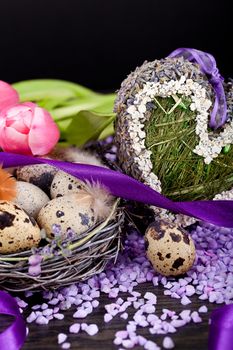 pink tulips and brown eggs with purple ribbon colorful easter decoration