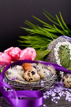 pink tulips and brown eggs with purple ribbon colorful easter decoration