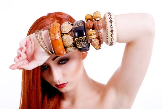 attractive young woman with shiny red hair and beauty makeup portrait