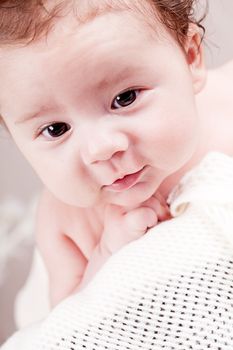 sweet little baby infant toddler on white  blanket in basket at home