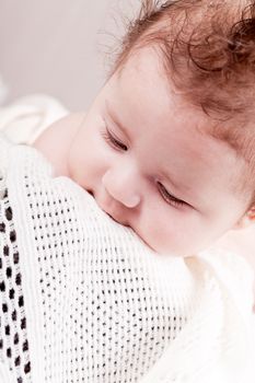 sweet little baby infant toddler on white  blanket in basket at home